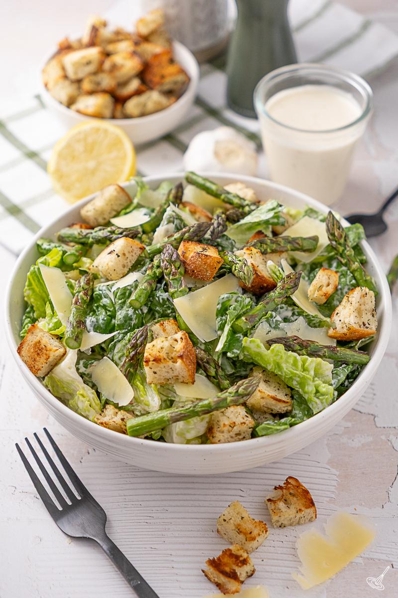 Grilled Asparagus Caesar Salad in a serving bowl.