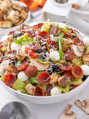 Deluxe Pizza Salad recipe in a serving bowl.