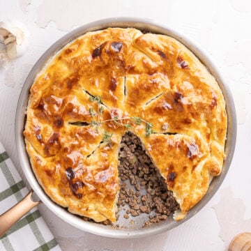 Skillet Tourtière Pot Pie being served on a table.