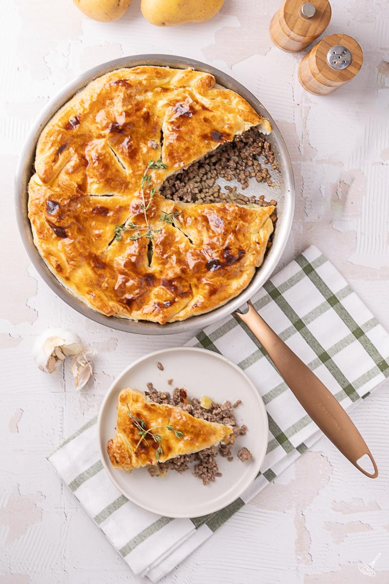 A Skillet Tourtière Pot Pie being served.