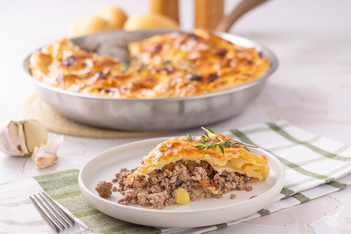A slice of Skillet Pumpkin Pot Pie on a plate.