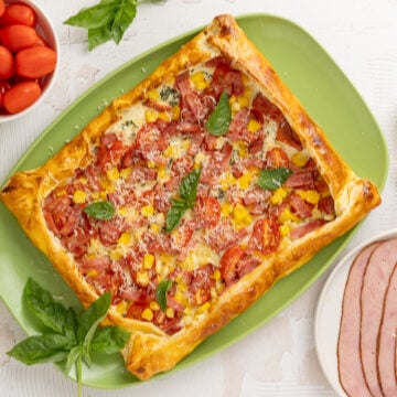 Corn, Tomato & Turkey Bacon Galette on a platter.