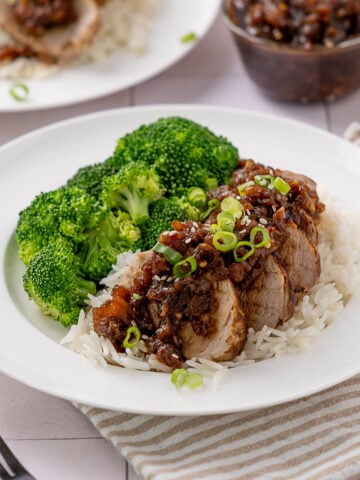 Sliced Pineapple Teriyaki Pork Tenderloin over rice with broccoli.