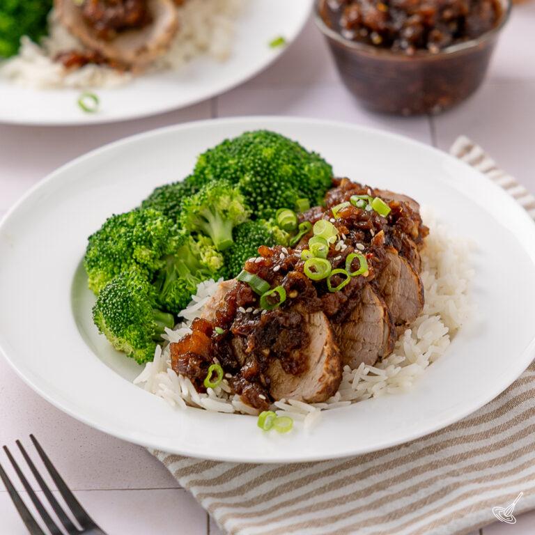 Sliced Pineapple Teriyaki Pork Tenderloin over rice with broccoli.