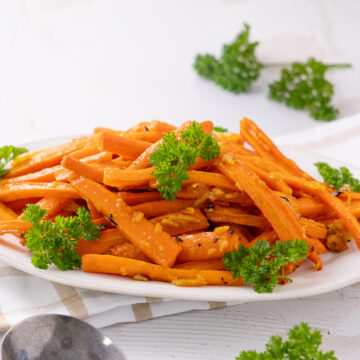 roasted orange marmalade glazed carrots on a serving plate