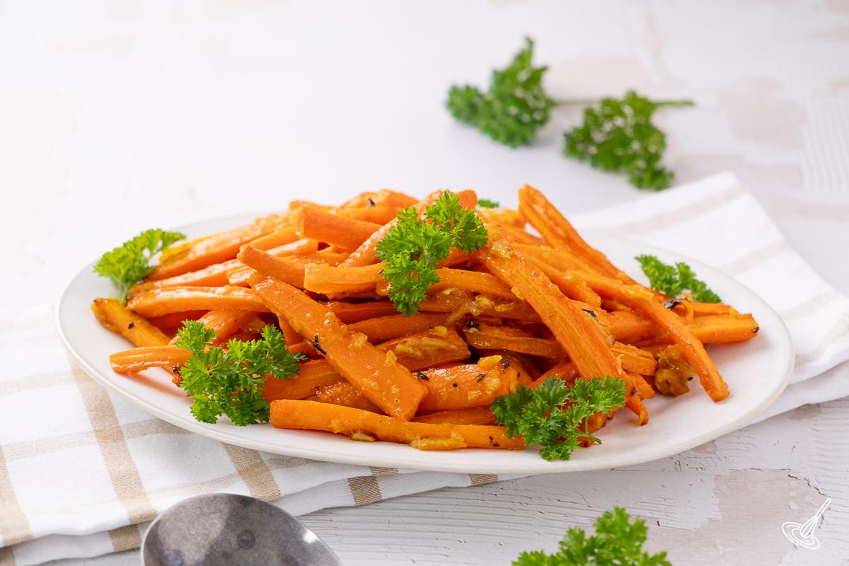 roasted orange marmalade glazed carrots on a serving plate