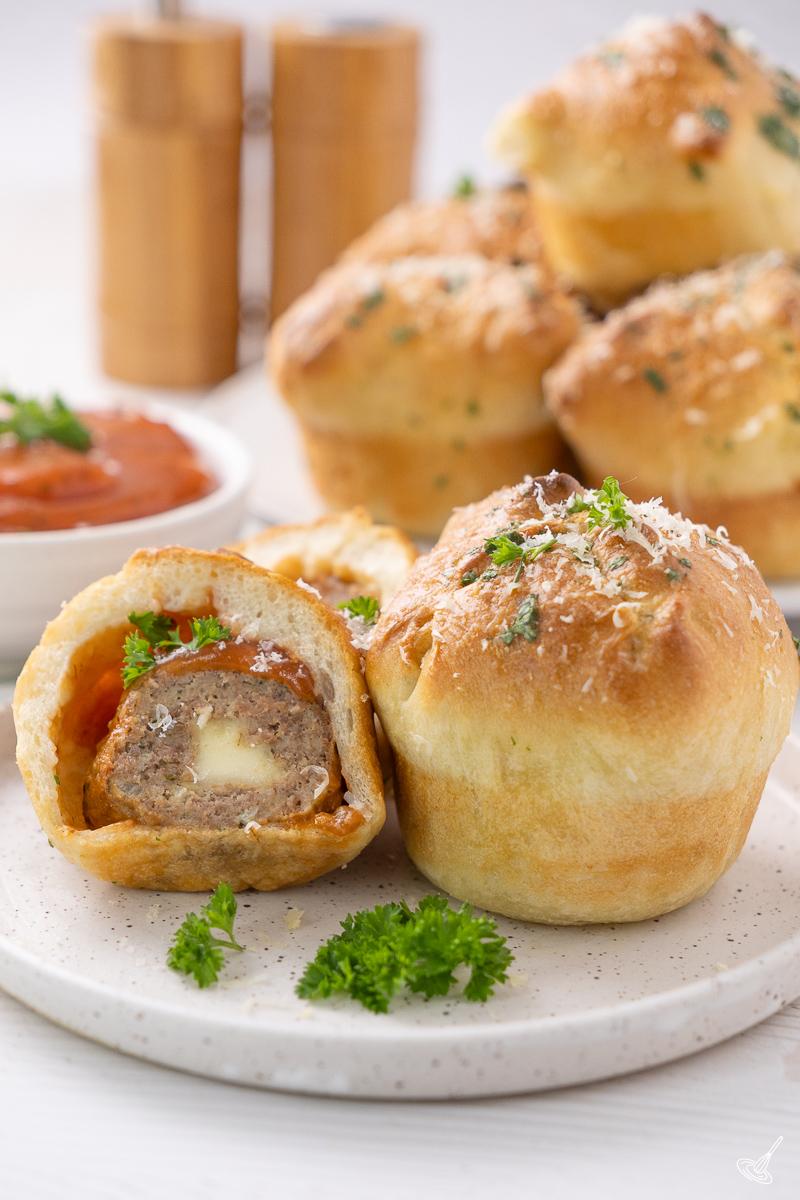 Turkey meatball pizza muffins on a plate.