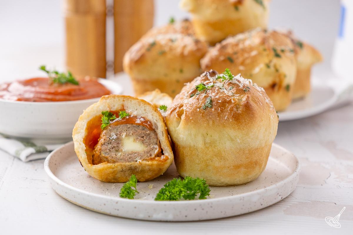 Turkey meatball pizza muffins on a plate.